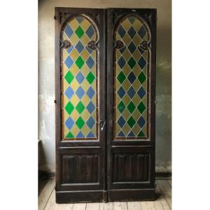 Porta vetrata raffinata con mosaico legato a piombo e telaio in rovere massello.