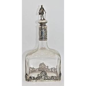 Antique Silver Mounted Glass Decanter – Figurine Top & Floral Etching – 24cm