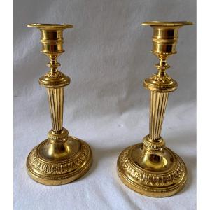 Pair Of Directoire Period Candlesticks In Gilded Bronze