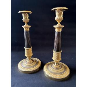 Pair Of Empire-style Candlesticks Signed Mene In Gilt Bronze