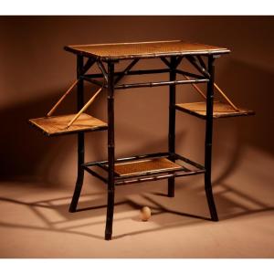 Anglo Indian, In The Aesthetic Movement Style Ebonised Bamboo And Woven Reed Coffee/tea Table.
