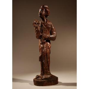  A Very Interesting Japanese Wooden Carved Sculpture Of A Geisha In The Nata-tsukuri Style.