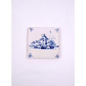18th-century Delftware Tile Depicting A Peasant Scene With A Farmer Seen From Behind