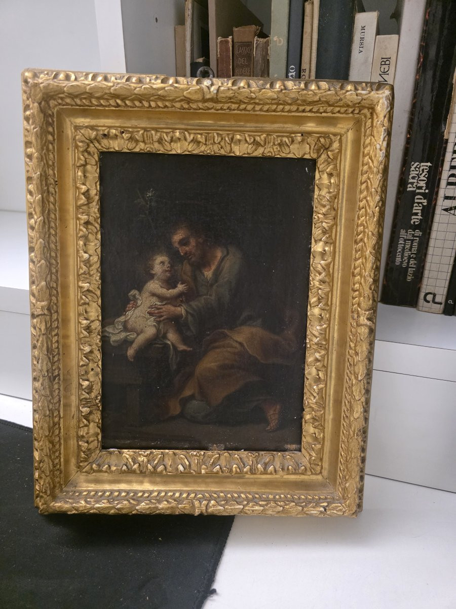 Dipinto raffigurante di San Giuseppe con il Bambino Gesù. Epoca barocca.-photo-1