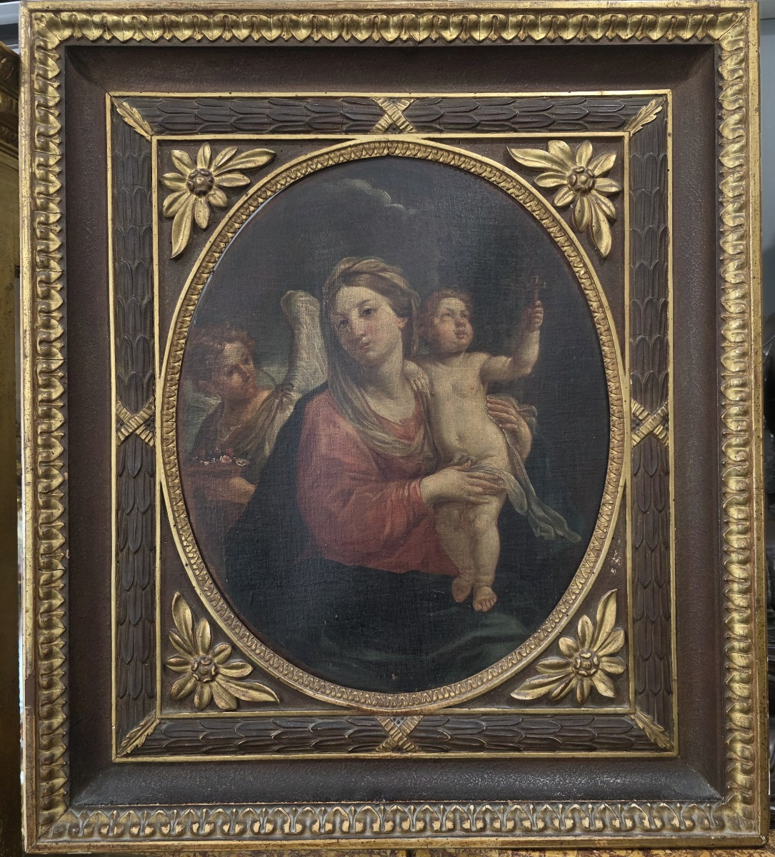 Olio su﻿ tela ovale raffigurante Madonna e Bambino e Angelo. Italia XVII