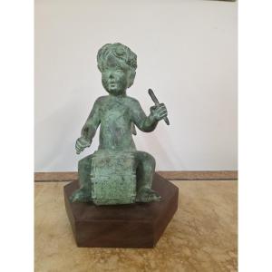 Putto con le ali che suona. Bronzo patinato dell'ottocento