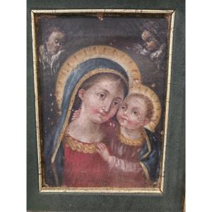 Olio su tela raffigurante Madonna con Bambino del settecento.