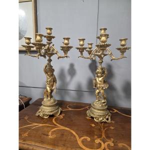 Coppia di candelabri in bronzo dorato con  due putti Francia metà ottocento