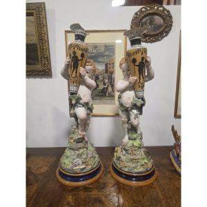 Coppia di putti in maiolica con vasi Ginori fine ottocento