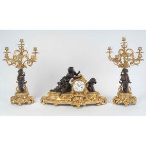 A Patinated And Gilt Bronze Mantel Clock And Candelabra Set, 19th Century