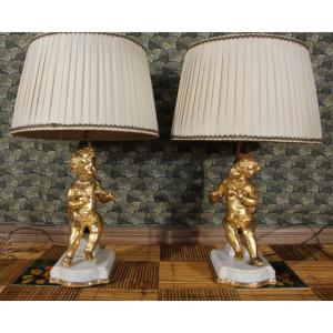 Pair Of Putti Lamps In Gilt Bronze