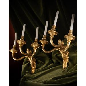 Set Of Four “transition” Gilt Bronze Three-light Wall-lights
