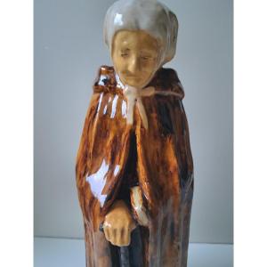 Old Woman In Ceramic Pottery From Bredeus