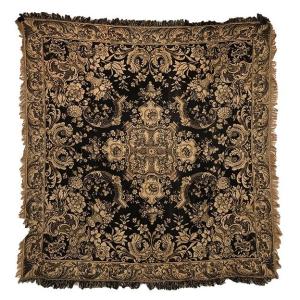 Antique Tapestry Or Tablecloth On A Black Background With Rich Floral Designs