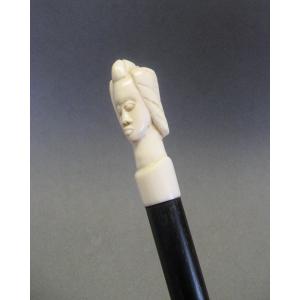 Walking Stick With A Pommel Shaped Like A Woman's Head.