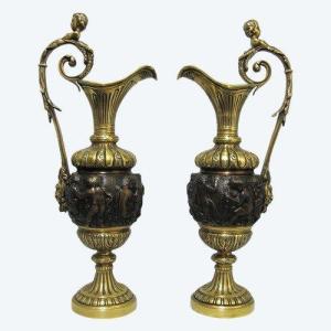 Pair Of Ewers In Nineteenth Bronze.