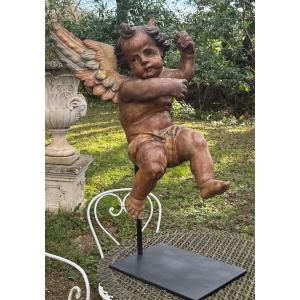 Carved And Polychrome Wooden Cherub