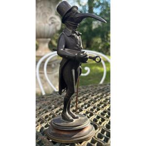 Caricatured Doctor With A Bird's Head Administering An Enema