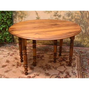 Round Dining Table, 2 Drop Leaves, 6 Legs In Walnut, Sold Without Extensions