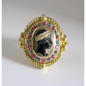 An 18k Gold, Ruby And Sapphire Hard Stone Cameo Ring