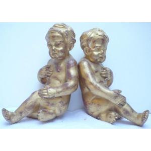 Two Seated Putti In Gilded Wood.