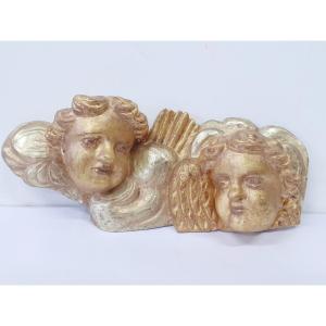 Two Gilded Wooden Angel Heads.