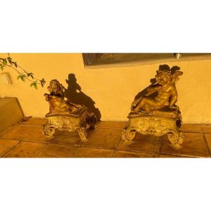 Pair Of Andirons With Putti In Gilt Bronze