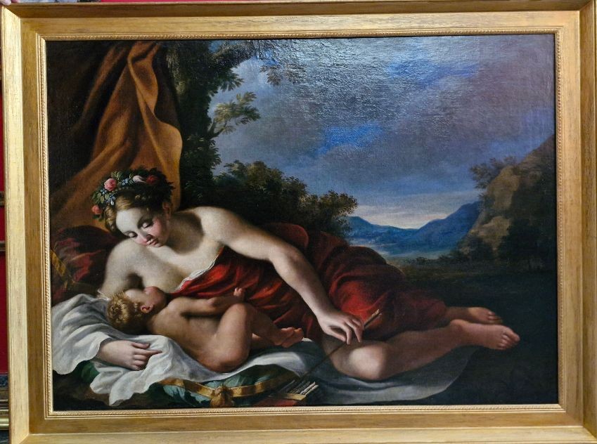 Figura femminile con bambino in paesaggio