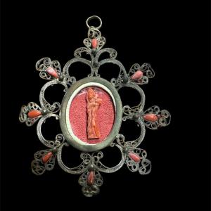 Filigrana in argento e corallo.