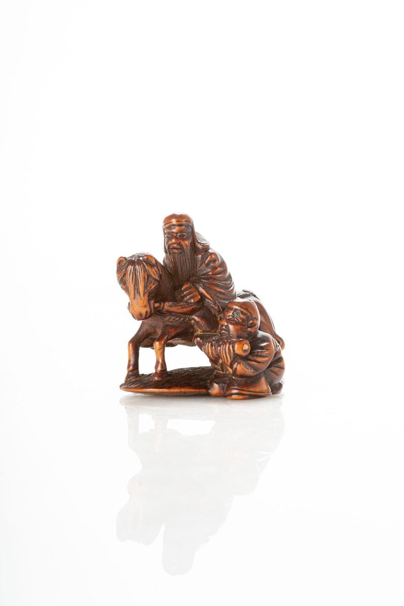 Netsuke in legno di bosso saggio a cavallo 