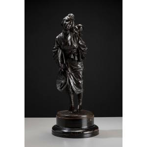 Scultura in bronzo della Scuola di Tokyo raffigurante una giovane madre con bambino