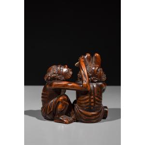 Okimono shunga in legno di bosso con Ashinaga e Tenaga 