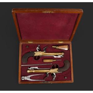 A Case Containing A Pair Of Flintlock Naval Pistols With Bayonets, Circa 1800.