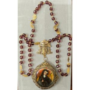 Rosario con Santa Rita in filigrana di argento del XIX secolo 