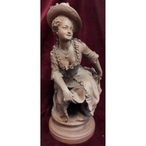 SCULTURA EROTICA IN TERRACOTTA DONNA CHE ALZA LA GONNA