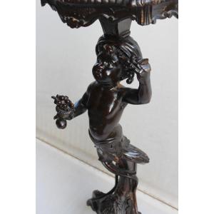 TRESPOLO IN LEGNO INTAGLIATO "PUTTO", ITALIA FINE XIX SECOLO.