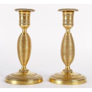 Pair Of Small Empire-era "ragot" Candlesticks In Chiseled And Gilt Bronze, C. 1805-1815