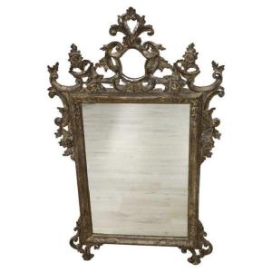 Specchio da parete in legno intagliato e argentato