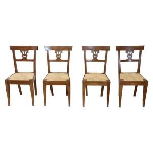 Serie di quattro raffinate sedie Impero in legno di noce