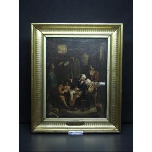 Scuola fiamminga, interno con figure in osteria