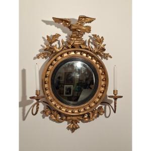 A So-called Witch's Mirror In Gilded Wood Surmounted By An Eagle