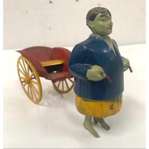 Antique Chinese Painted Tin Rickshaw Toy Circa 1930. 20th Century.