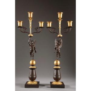 Pair Of Candelabra In Gilt And Patinated Bronze With Putti