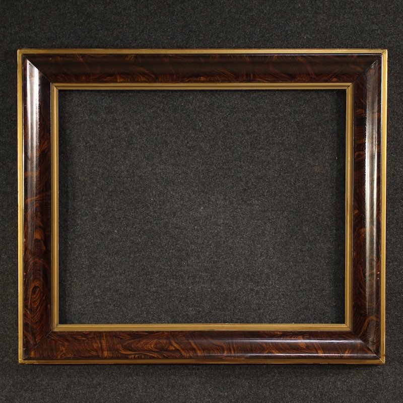 Cornice in legno laccato e dorato del XX secolo