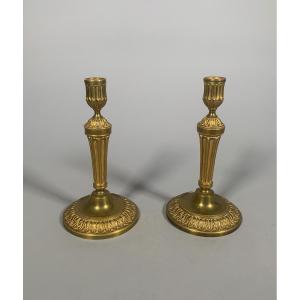 Louis XVI Period Candlesticks In Chiseled And Gilded Bronze.