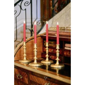 Suite Of Four Candlesticks In Gilt And Chiseled Bronze