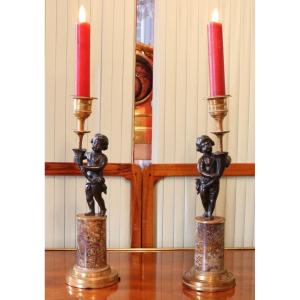 Pair Of Louis XVI Candlesticks In Gilt And Patinated Bronze Representing A Putto