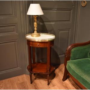 An Oval Mahogany And An Oval Mahogany And Mahogany Veneer Side Table
