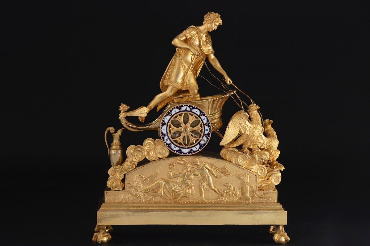 Importante pendola in bronzo dorato e finemente cesellato rappresentante Ganimede su un carro