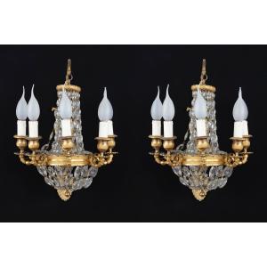 Coppia di appliques a mongolfiera in cristallo e bronzo dorato e cesellato a cinque bracci